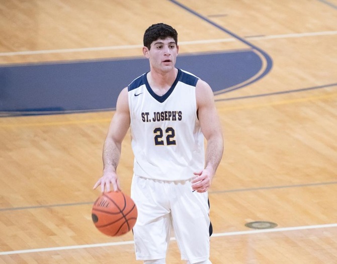 Basile Scores 1,000th Point as Men’s Basketball Falls to Yeshiva